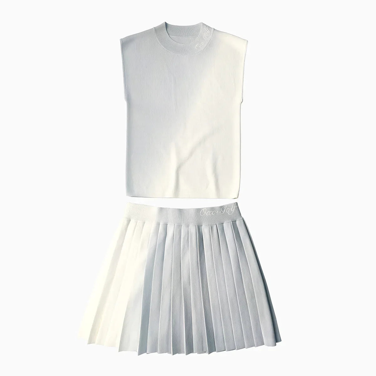 White sleeveless top and pleated skirt set on a white background