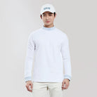 Person wearing a white long-sleeve shirt and cap on a plain background