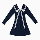 Navy blue dress with white trim on a white background