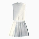 White sleeveless top and pleated skirt set on a white background