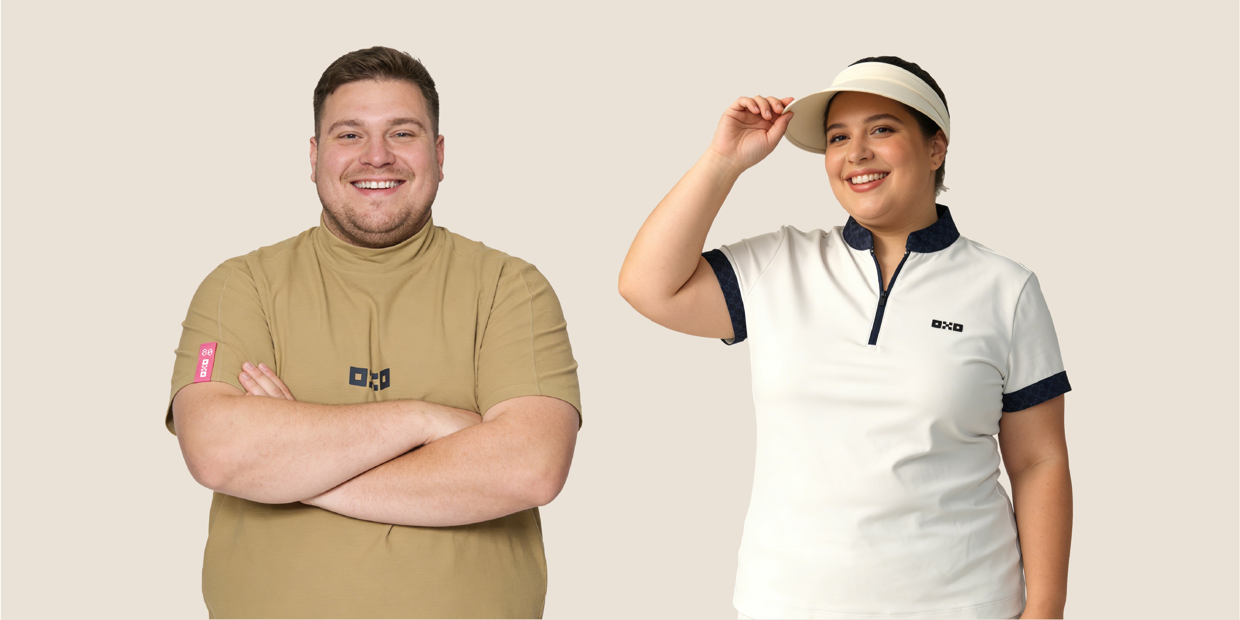Two people wearing branded clothing against a plain background